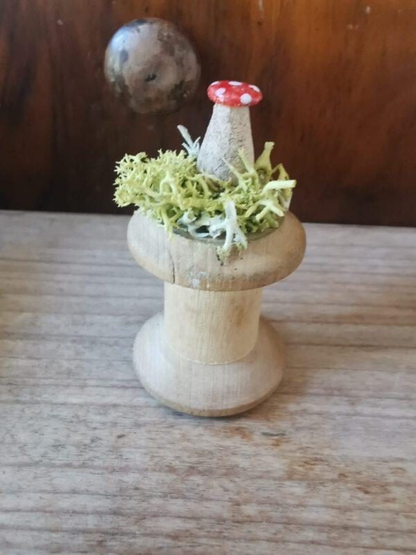 Glücksbringer auf Fadenspule